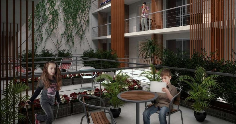 Interior de edificio jardin con niños divirtiendose Neo Buxareo