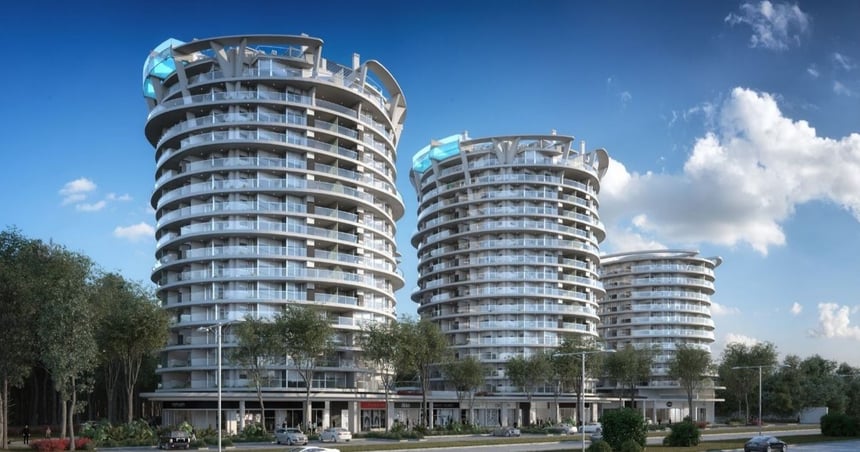 Vista del edificio AVA La Caleta de diseño circular, con ventanales amplios en Montevideo de Compass desarrollo inmobiliario