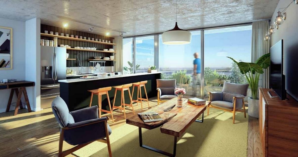 Interior de un apartamento en el edificio 01 Las Artes de la desarrolladora inmobiliaria Vitrium Capital en Montevideo con barra alta y buena decoración